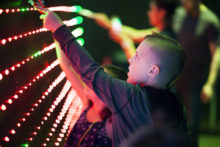 AUSTIN, TEXAS - MAY 7, 2016: Children and adults interacting with 'Paint by RGB', an interactive art sculpture at the 2016 Maker Faire in Austin, Texas.